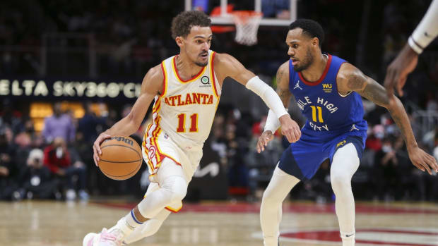Dec 17, 2021; Atlanta, Georgia, USA; Atlanta Hawks guard Trae Young (11) drives on Denver Nuggets guard Monte Morris (11) in the second half at State Farm Arena. Mandatory Credit: Brett Davis-USA TODAY Sports
